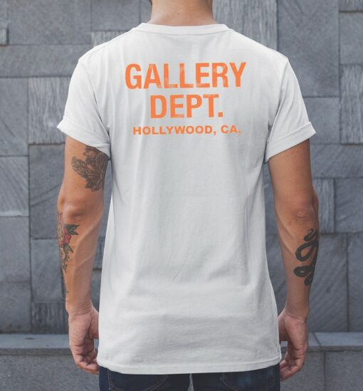 white and orange gallery dept shirt